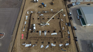 Aerial view of 1,740 CY post-tensioned slab construction for Argenta multi-family project