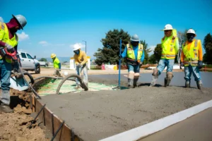 Concrete construction crew installing post-tension slab systems in Colorado