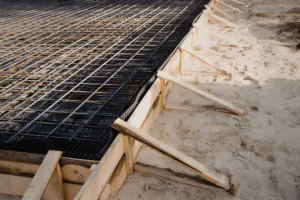 Wood formwork and steel rebar grid prepared for a commercial concrete slab on grade pour