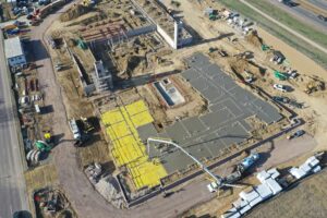 Aerial view of podium concrete slab construction and site preparation